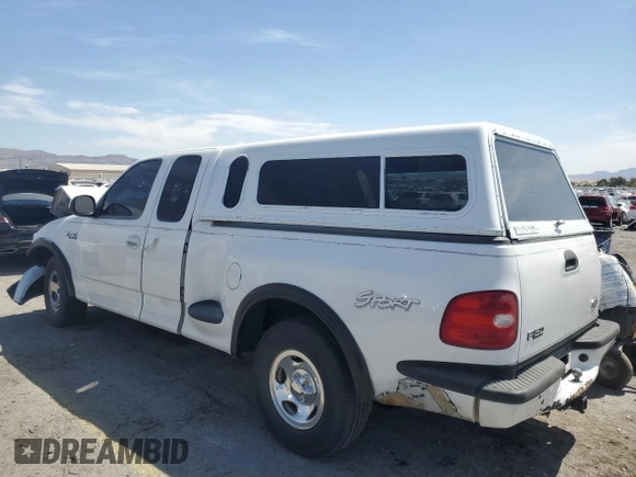 1999 Ford F-150 XL with VIN 1FTZX0726XKA98752, listed as a Copart auction lot 58986695 with Not provided miles and Salvage title. Bid and sale history available at DreamBid. Image 2.