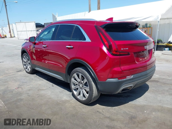2021 Cadillac XT4 FWD Premium Luxury z VIN 1GYFZCR48MF004849, wystawiony jako IAAI lot #42131896 z przebiegiem 9 864 mil mil oraz . Historia ofert i sprzedaży dostępna na DreamBid. Obrazek 3.