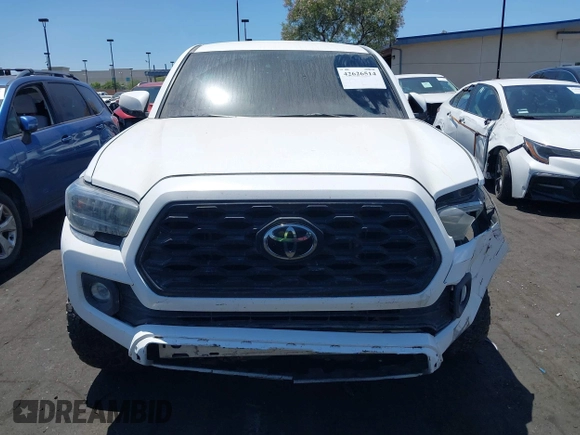 2023 Toyota Tacoma SR with VIN 3TMCZ5AN4PM558760, listed as a IAAI auction lot 42626514 with 39,335 mi miles and . Bid and sale history available at DreamBid. Image 12.