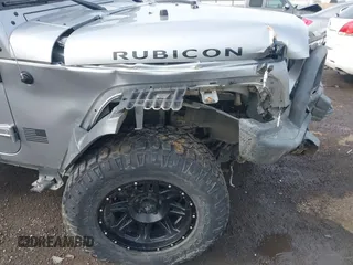 2013 Jeep Wrangler Rubicon 10th Anniversary with VIN 1C4BJWCG8DL639121, listed as a IAAI auction lot 40561773 with 56,023 mi miles and . Bid and sale history available at DreamBid. Image 17.