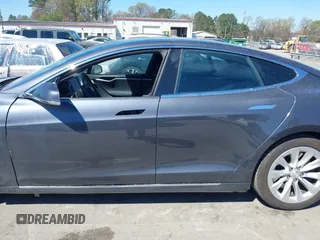 2017 Tesla Model S 100D with VIN 5YJSA1E20HF198503, listed as a IAAI auction lot 41843782 with 77,281 mi miles and . Bid and sale history available at DreamBid. Image 15.