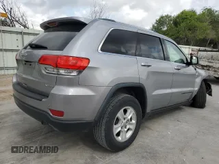 2017 Jeep Grand Cherokee Laredo with VIN 1C4RJEAG0HC664063, listed as a Copart auction lot 54850295 with 82,913 mi miles and Salvage title. Bid and sale history available at DreamBid. Image 3.