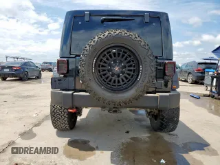 2014 Jeep Wrangler Unlimited Rubicon с VIN 1C4HJWFG1EL156853, выставлен на аукционе Copart как лот 58496795 с пробегом 112 073 миль миль и Списание • Salvage title. История ставок и продаж доступна на DreamBid. Изображение 6.