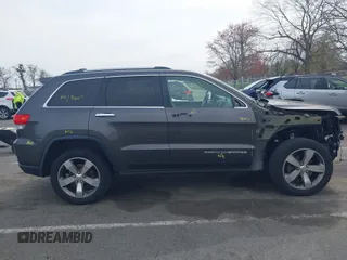 2016 Jeep Grand Cherokee Limited 75th Anniversary with VIN 1C4RJFBG5GC497766, listed as a IAAI auction lot 42048662 with 164,281 mi miles and . Bid and sale history available at DreamBid. Image 13.