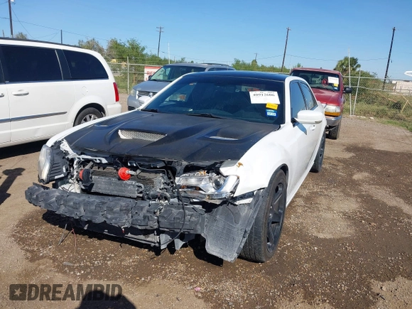2012 Chrysler 300 SRT-8 with VIN 2C3CCAFJ9CH801749, listed as a IAAI auction lot 40912606 with 144,404 mi miles and . Bid and sale history available at DreamBid. Image 6.