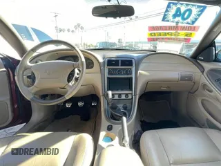 2004 Ford Mustang GT Deluxe z VIN 1FAFP45XX4F150757, wystawiony jako Copart lot #51550375 z przebiegiem 43 827 mil mil oraz Tytuł czysty. Historia ofert i sprzedaży dostępna na DreamBid. Obrazek 9.