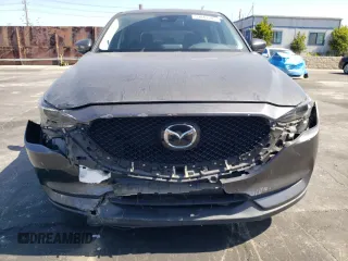 2019 Mazda CX-5 Grand Touring with VIN JM3KFADM6K1641992, listed as a Copart auction lot 57862345 with 37,100 mi miles and Salvage title. Bid and sale history available at DreamBid. Image 5.