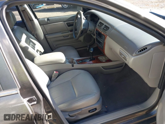 2004 Mercury Sable LS Premium z VIN 1MEHM55S54G607845, wystawiony jako IAAI lot #41812758 z przebiegiem 200 883 mil mil oraz . Historia ofert i sprzedaży dostępna na DreamBid. Obrazek 5.