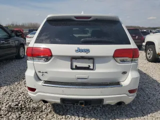 2020 Jeep Grand Cherokee Overland with VIN 1C4RJFCG4LC398526, listed as a Copart auction lot 54221205 with 122,046 mi miles and Salvage Title. Bid and sale history available at DreamBid. Image 6.