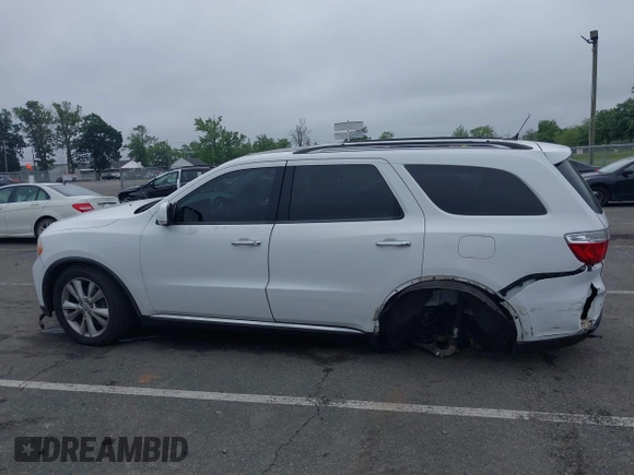 2013 Dodge Durango Crew with VIN 1C4RDJDG4DC518156, listed as a IAAI auction lot 42516880 with 162,402 mi miles and . Bid and sale history available at DreamBid. Image 14.