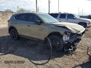 2024 Mazda CX-5 2.5 Carbon Turbo with VIN JM3KFBAYXR0521660, listed as a Copart auction lot 42415895 with 4,857 mi miles and Clean Title. Bid and sale history available at carsss.com. Image 4.