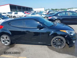 2012 Hyundai Veloster w/Black Int z VIN KMHTC6AD4CU078413, wystawiony jako IAAI lot #42611032 z przebiegiem 142 295 mil mil oraz . Historia ofert i sprzedaży dostępna na DreamBid. Obrazek 13.