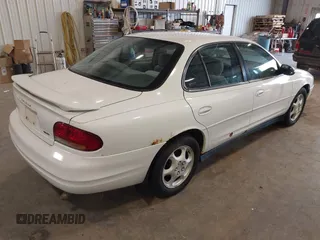 1999 Oldsmobile Intrigue GX z VIN 1G3WH52K6XF328030, wystawiony jako IAAI lot #42334804 z przebiegiem Nie podano mil oraz . Historia ofert i sprzedaży dostępna na DreamBid. Obrazek 4.