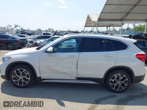 2021 BMW X1 sDrive28i z VIN WBXJG7C01M3M73496, wystawiony jako IAAI lot #42132005 z przebiegiem 23 278 mil mil oraz . Historia ofert i sprzedaży dostępna na DreamBid. Obrazek 14.