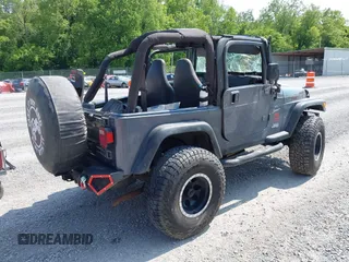 2001 Jeep Wrangler Sport z VIN 1J4FA49S11P322636, wystawiony jako IAAI lot #42409917 z przebiegiem 88 675 mil mil oraz . Historia ofert i sprzedaży dostępna na DreamBid. Obrazek 4.