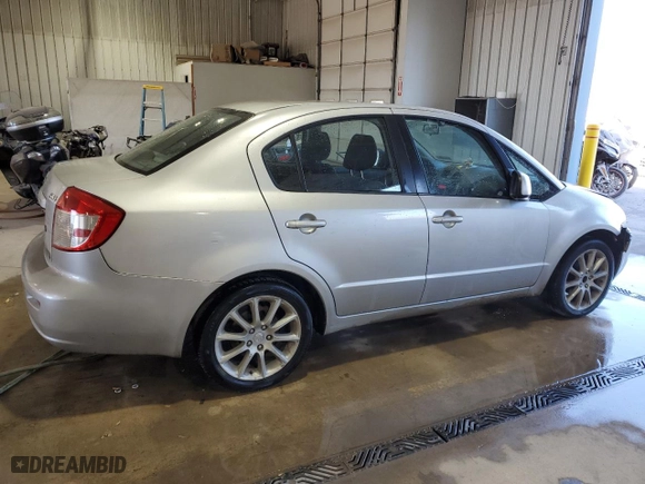 2011 Suzuki SX4 LE with VIN JS2YC5A24B6300735, listed as a Copart auction lot 77143914 with 69,338 mi miles and Salvage Title. Bid and sale history available at carsss.com. Image 3.