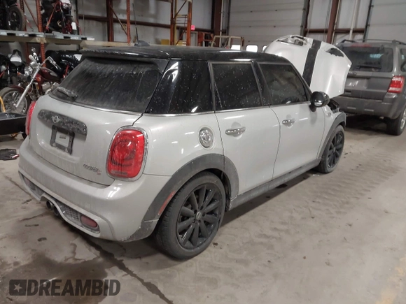2015 MINI Hardtop 4 Door S with VIN WMWXU3C56F2B66449, listed as a IAAI auction lot 41296784 with 53,589 mi miles and . Bid and sale history available at DreamBid. Image 4.