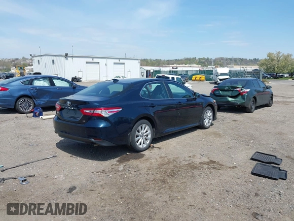 2019 Toyota Camry LE with VIN 4T1B11HK6KU276644, listed as a IAAI auction lot 42037249 with 23,677 mi miles and . Bid and sale history available at DreamBid. Image 4.