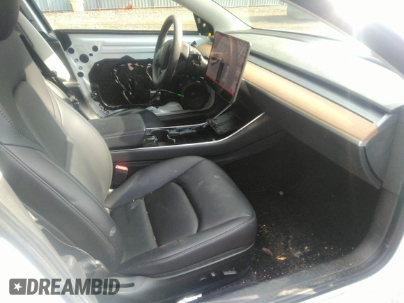 2020 Tesla Model 3 Standard Range Plus with VIN 5YJ3E1EA4LF792830, listed as a IAAI auction lot 41852919 with 76,461 mi miles. Bid and sale history available at carsss.com. Image 5.