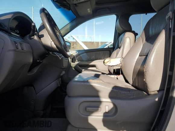 2009 Honda Odyssey EX-L with VIN 5FNRL38619B044063, listed as a Copart auction lot 52372505 with 204,658 mi miles and Salvage Title. Bid and sale history available at DreamBid. Image 7.