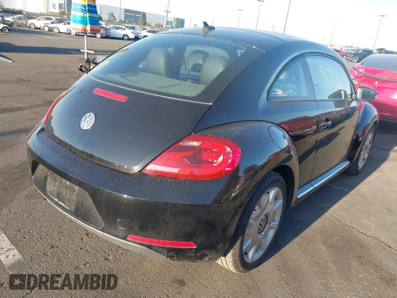 2012 Volkswagen Beetle 2.5L w/Sound/Nav PZEV with VIN 3VWJP7AT7CM661055, listed as a IAAI auction lot 41980159 with 113,678 mi miles and . Bid and sale history available at DreamBid. Image 4.