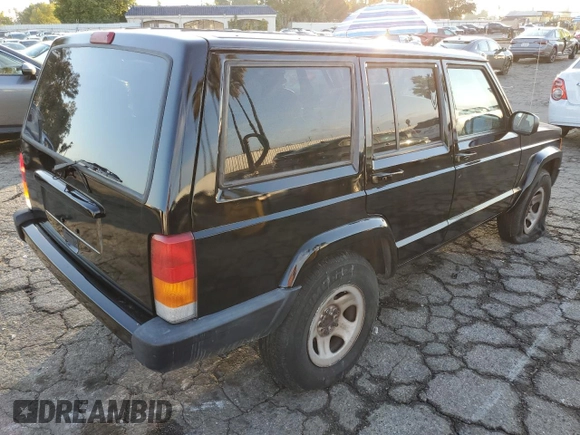 2001 Jeep Cherokee Sport with VIN 1J4FT48S51L568981, listed as a Copart auction lot 82471104 with 181,870 mi miles and Salvage Title. Bid and sale history available at carsss.com. Image 3.