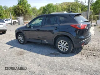 2015 Mazda CX-5 Touring with VIN JM3KE4CY6F0434538, listed as a Copart auction lot 54966145 with 209,447 mi miles and Clean Title. Bid and sale history available at DreamBid. Image 2.