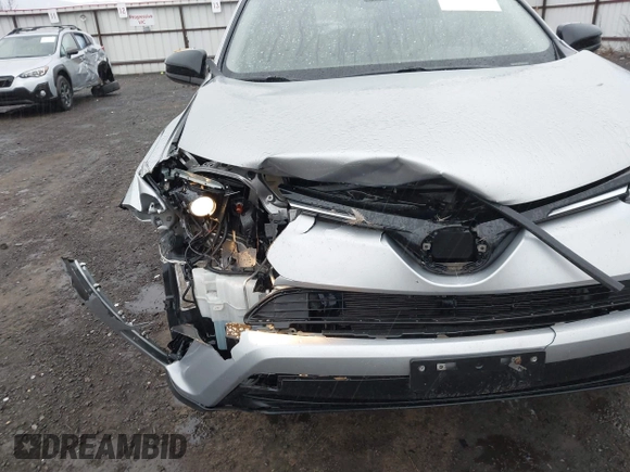 2018 Toyota RAV4 LE with VIN 2T3BFREV9JW724606, listed as a IAAI auction lot 41862028 with 98,590 mi miles. Bid and sale history available at carsss.com. Image 6.