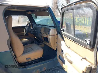 1997 Jeep Wrangler Sport with VIN 1J4FY19S1VP426589, listed as a IAAI auction lot 41865628 with 171,770 mi miles. Bid and sale history available at carsss.com. Image 5.