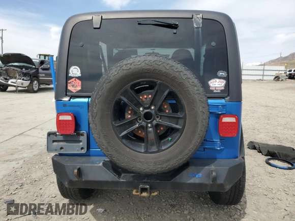 2002 Jeep Wrangler Sport with VIN 1J4FA49S32P762794, listed as a Copart auction lot 52132955 with 243,499 mi miles and Salvage Title. Bid and sale history available at carsss.com. Image 6.