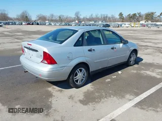 2004 Ford Focus SE with VIN 1FAFP34394W120884, listed as a IAAI auction lot 41663180 with 213,972 mi miles and . Bid and sale history available at DreamBid. Image 4.