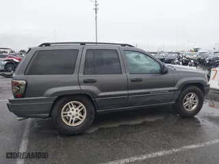2004 Jeep Grand Cherokee Laredo with VIN 1J4GX48S14C177923, listed as a IAAI auction lot 41745772 with 242,506 mi miles. Bid and sale history available at carsss.com. Image 13.