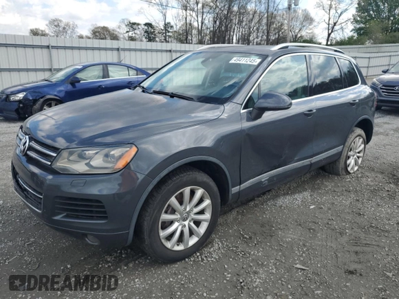 2012 Volkswagen Touareg Sport с VIN WVGEK9BP7CD006059, выставлен на аукционе Copart как лот 49411245 с пробегом 202 323 миль миль и Чистый • Clean title. История ставок и продаж доступна на DreamBid. Изображение 1.