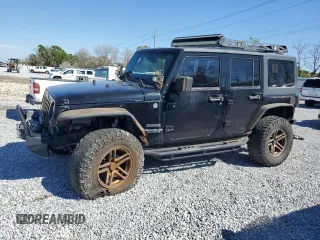 2014 Jeep Wrangler Unlimited Sport with VIN 1C4BJWDGXEL269693, listed as a Copart auction lot 46927895 with 105,691 mi miles and Salvage Title. Bid and sale history available at carsss.com. Image 1.
