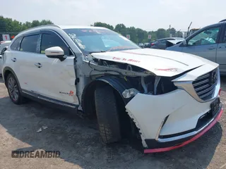 2020 Mazda CX-9 Grand Touring z VIN JM3TCBDY3L0410674, wystawiony jako IAAI lot #42389157 z przebiegiem 130 519 mil mil oraz . Historia ofert i sprzedaży dostępna na DreamBid. Obrazek 1.
