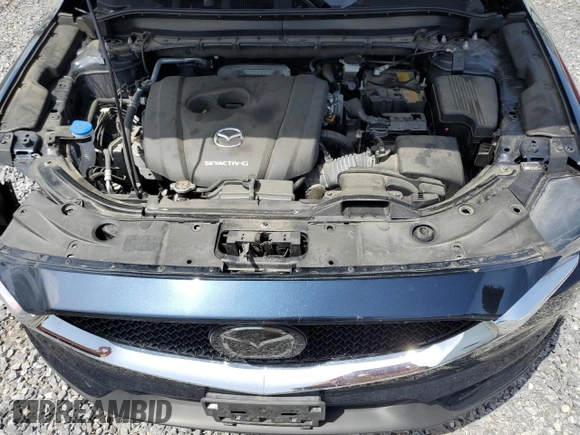 2021 Mazda CX-5 Touring with VIN JM3KFBCM0M0302015, listed as a Copart auction lot 55077305 with 40,558 mi miles and Salvage Title. Bid and sale history available at carsss.com. Image 12.