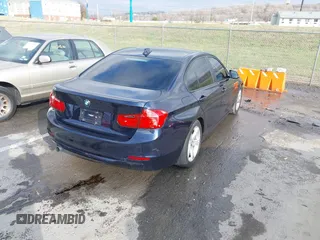 2013 BMW 3 Series 320i with VIN WBA3B1C58DK129051, listed as a IAAI auction lot 41119380 with 101,427 mi miles. Bid and sale history available at carsss.com. Image 4.