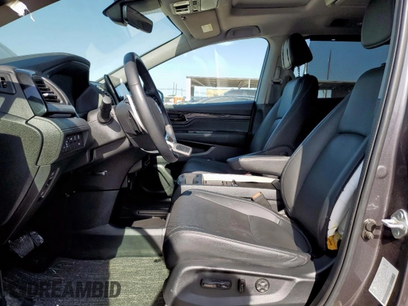 2023 Honda Odyssey Touring with VIN 5FNRL6H89PB053593, listed as a Copart auction lot 64836685 with 26,568 mi miles and Salvage title. Bid and sale history available at DreamBid. Image 7.