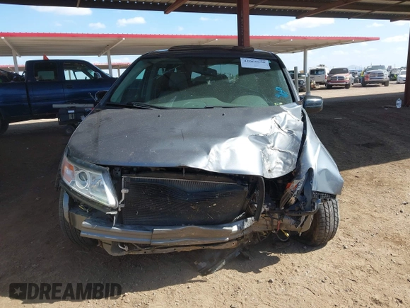 2012 Honda Odyssey EX-L with VIN 5FNRL5H6XCB103498, listed as a IAAI auction lot 42065658 with 104,933 mi miles and . Bid and sale history available at carsss.com. Image 6.