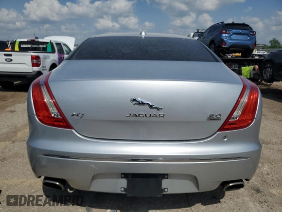 2015 Jaguar XJ with VIN SAJWJ1CD1F8V75232, listed as a Copart auction lot 57605685 with 146,314 mi miles and Salvage title. Bid and sale history available at DreamBid. Image 6.
