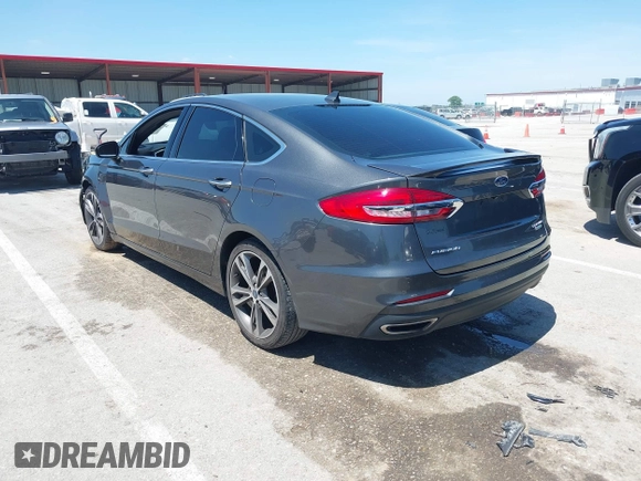 2020 Ford Fusion Titanium with VIN 3FA6P0K96LR173971, listed as a IAAI auction lot 42232469 with 82,474 mi miles and . Bid and sale history available at DreamBid. Image 3.