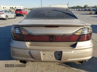 2002 Pontiac Bonneville SLE z VIN 1G2HY54K424205499, wystawiony jako Copart lot #76815334 z przebiegiem 84 715 mil mil oraz Szkoda całkowita • Salvage title. Historia ofert i sprzedaży dostępna na DreamBid. Obrazek 6.