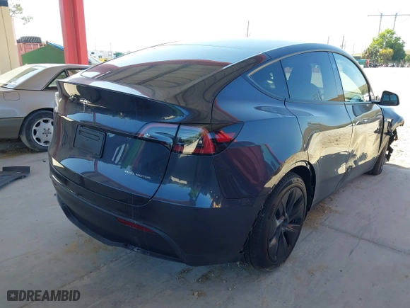 2025 Tesla Model Y Long Range with VIN 7SAYGDEE3SA367750, listed as a IAAI auction lot 41933682 with 1,127 mi miles. Bid and sale history available at carsss.com. Image 4.