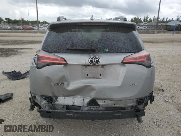 2018 Toyota RAV4 XLE with VIN 2T3WFREV4JW444884, listed as a Copart auction lot 55666275 with 174,275 mi miles and Salvage Title. Bid and sale history available at DreamBid. Image 6.