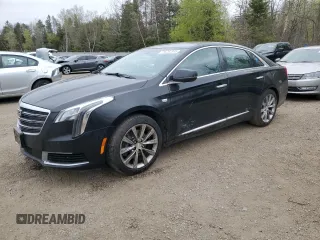 2018 Cadillac XTS Livery z VIN 2G61U5S35J9132260, wystawiony jako Copart lot #56282945 z przebiegiem 898 389 mil mil oraz Czysty tytuł • Clean title. Historia ofert i sprzedaży dostępna na DreamBid. Obrazek 1.