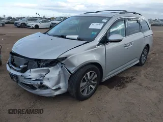 2014 Honda Odyssey Touring with VIN 5FNRL5H93EB066162, listed as a IAAI auction lot 41734783 with 173,063 mi miles and . Bid and sale history available at DreamBid. Image 17.
