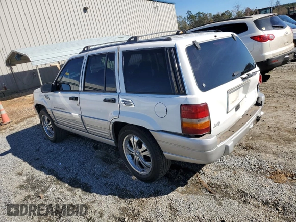 1996 Jeep Grand Cherokee Laredo with VIN 1J4FX58SXTC349575, listed as a Copart auction lot 80545584 with 302,636 mi miles and Salvage Title. Bid and sale history available at carsss.com. Image 2.