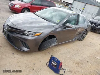 2019 Toyota Camry LE with VIN 4T1B11HK0KU263338, listed as a IAAI auction lot 41826497 with 63,676 mi miles. Bid and sale history available at carsss.com. Image 2.