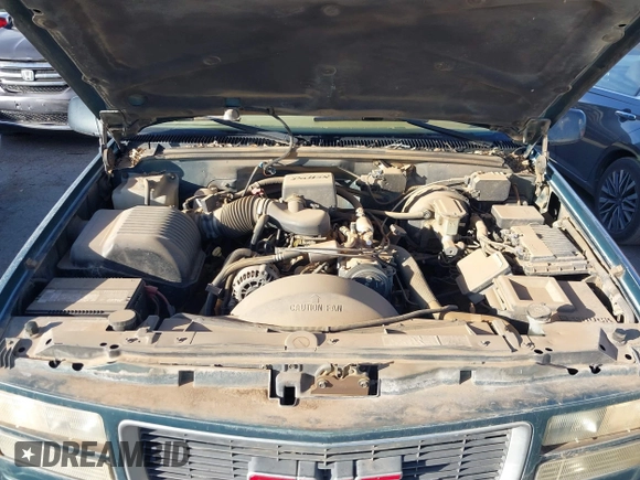 1997 GMC Yukon with VIN 1GKEK13R1VJ723409, listed as a IAAI auction lot 41512184 with 235,988 mi miles. Bid and sale history available at carsss.com. Image 10.