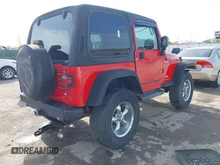 2004 Jeep Wrangler Sport with VIN 1J4FA49S54P744171, listed as a IAAI auction lot 41974657 with 173,230 mi miles. Bid and sale history available at carsss.com. Image 4.